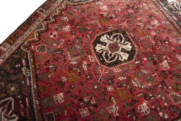 Backside of handmade 2000s Shiraz rug showing knot structure and weave density