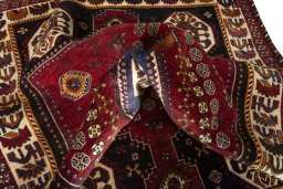 Surface texture of 2000s Shiraz rug with natural Wool and intricate pattern