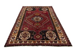 Surface texture of 2000s Shiraz rug with natural Wool and intricate pattern