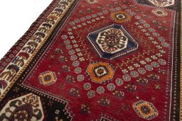 Backside of handmade 2000s Shiraz rug showing knot structure and weave density