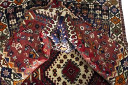 Corner detail of 2000s Shiraz rug showing border pattern and Wool pile