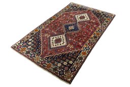 Corner detail of 2000s Shiraz rug showing border pattern and Wool pile