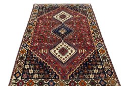 Surface texture of 2000s Shiraz rug with natural Wool and intricate pattern