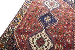 Backside of handmade 2000s Shiraz rug showing knot structure and weave density