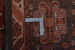 Surface texture of 2000s Shiraz rug with natural Wool and intricate pattern