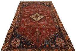 Surface texture of 2000s Shiraz rug with natural Wool and intricate pattern