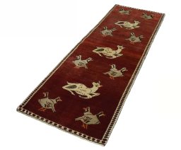 Corner detail of 2000s Shiraz rug showing border pattern and Wool pile