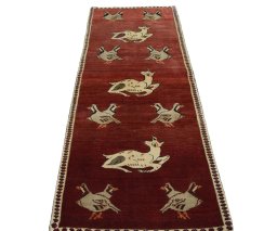 Surface texture of 2000s Shiraz rug with natural Wool and intricate pattern
