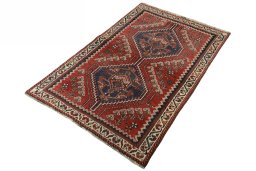 Corner detail of 2000s Shiraz rug showing border pattern and Wool pile