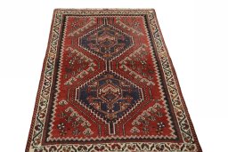 Surface texture of 2000s Shiraz rug with natural Wool and intricate pattern