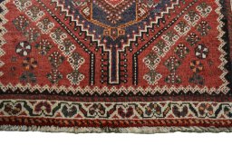 Central medallion detail of 2000s Shiraz rug from Iran / Persia