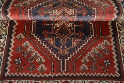 Full view of 2000s Shiraz rug from Iran / Persia, 145 × 98 cm in Red tones