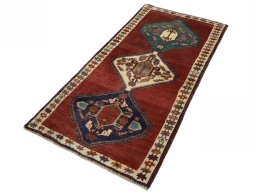 Corner detail of 2000s Shiraz rug showing border pattern and Wool pile