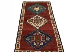 Surface texture of 2000s Shiraz rug with natural Wool and intricate pattern
