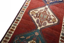 Backside of handmade 2000s Shiraz rug showing knot structure and weave density