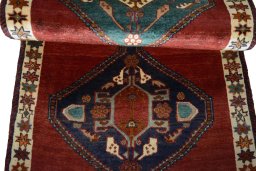 Full view of 2000s Shiraz rug from Iran / Persia, 172 × 85 cm in Red tones