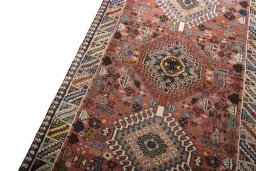 Backside of handmade 2000s Shiraz rug showing knot structure and weave density