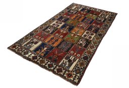 Corner detail of 2000s Shiraz rug showing border pattern and Wool pile