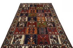 Surface texture of 2000s Shiraz rug with natural Wool and intricate pattern