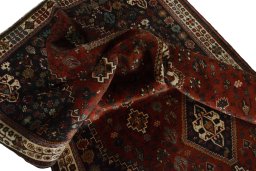Corner detail of 2000s Shiraz rug showing border pattern and Wool pile