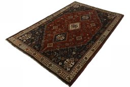 Corner detail of 2000s Shiraz rug showing border pattern and Wool pile