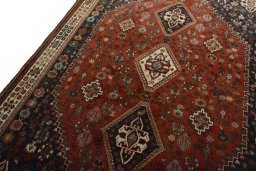 Backside of handmade 2000s Shiraz rug showing knot structure and weave density