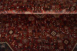 Corner detail of 2000s Shiraz rug showing border pattern and Wool pile