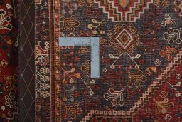 Surface texture of 2000s Shiraz rug with natural Wool and intricate pattern