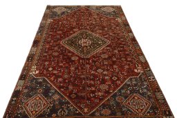 Surface texture of 2000s Shiraz rug with natural Wool and intricate pattern