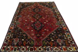 Surface texture of 1970s Shiraz rug with natural Wool and intricate pattern