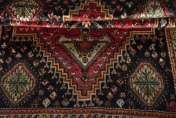Corner detail of 1970s Shiraz rug showing border pattern and Wool pile