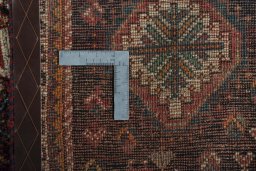 Surface texture of 1970s Shiraz rug with natural Wool and intricate pattern
