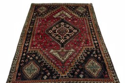 Surface texture of 1970s Shiraz rug with natural Wool and intricate pattern