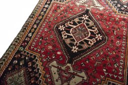 Backside of handmade 1970s Shiraz rug showing knot structure and weave density