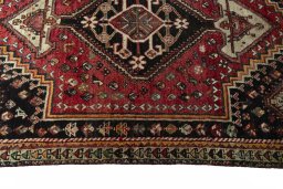 Full view of 1970s Shiraz rug from Iran / Persia, 171 × 120 cm in Red tones