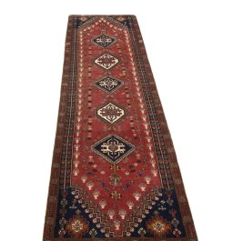 Surface texture of 2000s Shiraz rug with natural Wool and intricate pattern