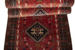 Full view of 2000s Shiraz rug from Iran / Persia, 295 × 82 cm in Red tones