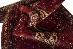 Corner detail of 2000s Shiraz rug showing border pattern and Wool pile