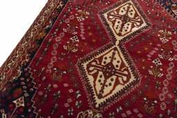 Backside of handmade 2000s Shiraz rug showing knot structure and weave density