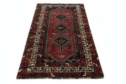 Surface texture of 2000s Shiraz rug with natural Wool and intricate pattern