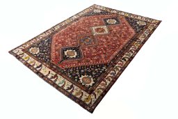 Corner detail of 2000s Shiraz rug showing border pattern and Wool pile