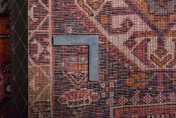 Surface texture of 2000s Shiraz rug with natural Wool and intricate pattern