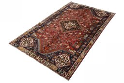 Corner detail of 2000s Shiraz rug showing border pattern and Wool pile