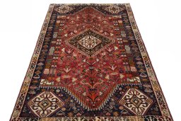 Surface texture of 2000s Shiraz rug with natural Wool and intricate pattern