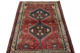 Surface texture of 2000s Shiraz rug with natural Wool and intricate pattern