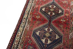 Backside of handmade 2000s Shiraz rug showing knot structure and weave density