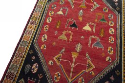 Backside of handmade 2000s Shiraz rug showing knot structure and weave density