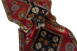Corner detail of 2000s Shiraz rug showing border pattern and Wool pile