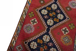 Backside of handmade 2000s Shiraz rug showing knot structure and weave density