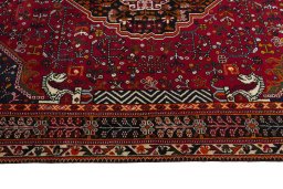 Corner detail of 2000s Shiraz rug showing border pattern and Wool pile